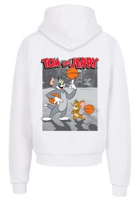 Bílé mikina s kapucí s grafikou Toma a Jerryho, jak si hrají s basketbalovými míči. Jasné barvy, kreslený design a hravé téma.
