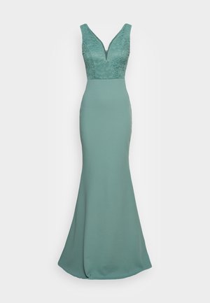Robe turquois avec un décolleté en V profond, corsage en dentelle, silhouette ajustée et jupe évasée. Tissu lisse et détails en dentelle complexes.