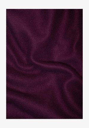 Ciemnofioletowy materiał o miękkiej, gładkiej teksturze, pokazujący łagodne fale i nierówne zagięcia, typowe dla lekkiej wełny lub materiału polarowego.
