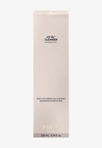 Nettoyant Babor HY-ÖL dans une boîte haute, mince et beige douce avec du texte noir ; 200 mL. Logo doré en bas, description du produit claire visible.