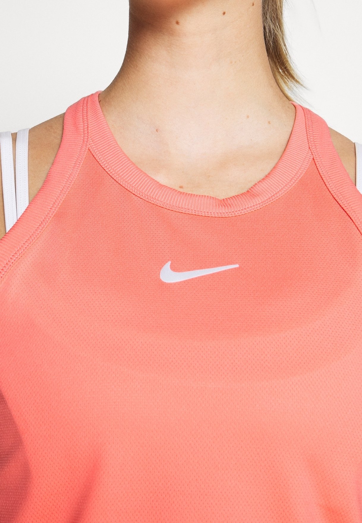 coral color nike shirt