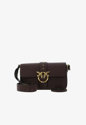 Burgundy leather shoulder bag featuring a gold-tone bird clasp, top flap closure, and a detachable, adjustable strap with perforations.