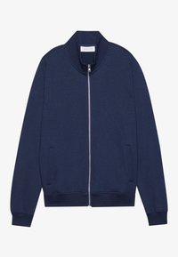 Marinblå zip-up jacka med ståkrage, ribbad mudd och framfickor. Tillverkad av mjukt material med en slät yta.