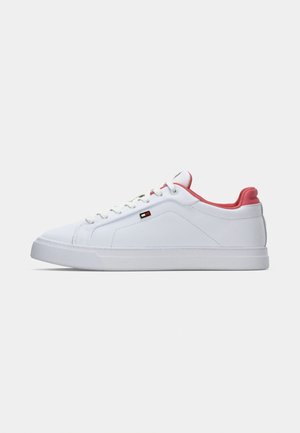 White low-top sneaker with pink inner lining, white laces, and a small rectangular logo on the side, shown in side profile.
