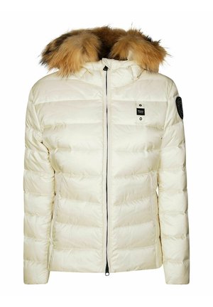 Giacca a vento in crema con cappuccio in pelliccia sintetica rimovibile, zip nera, texture trapuntata e dettaglio del logo sul lato sinistro del petto.