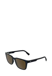 Occhiali da sole rettangolari con montatura in acetato blu scuro, lenti marroni sfumate e dettagli argento sulle aste. Design leggero e moderno.