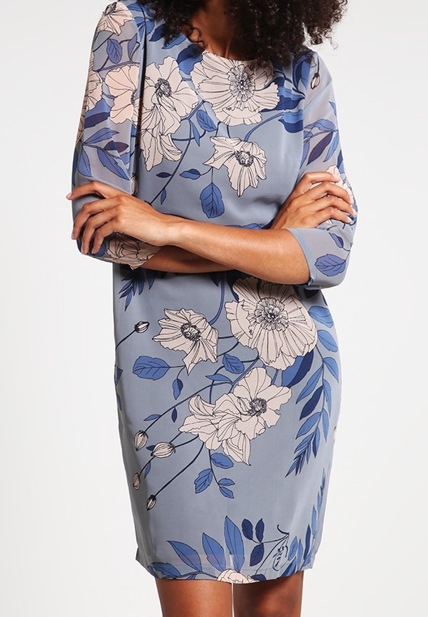 Floral print dress in light blue fabric, featuring three-quarter sleeves, a round neckline, and detailing of large beige and blue flowers.