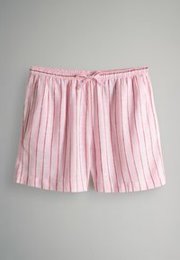 Pantaloni shorts rosa chiaro con strisce verticali rosse, vita elastica e nastrino frontale. Realizzati in un tessuto morbido, presentano due tasche laterali.
