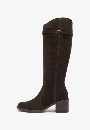 Tall dark brown suede boot with mid block heel and decorative strap with metal buckle near the top.