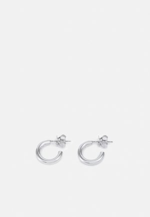 Silver hoop earrings with a polished finish, featuring a circular design and stud post for secure fastening. Rounded, smooth texture.