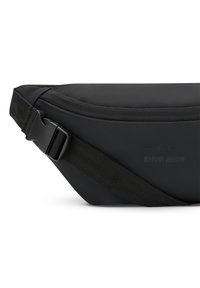 Black fanny pack made of durable fabric, featuring a zippered main compartment and an adjustable strap with a side release buckle.