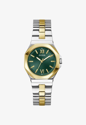 Ανδρικό ρολόι χειρός από μέταλλο δίχρωμο σε ασημί και χρυσό με πράσινο καντράν, χρυσούς λατινικούς αριθμούς στις 12 και 6, χρυσά δείκτες και λογότυπο «GUESS» κάτω από τη θέση 12 η ώρα.
