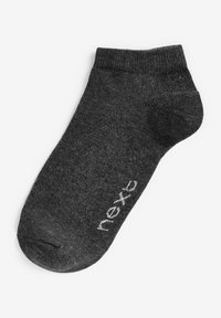 Chaussette de cheville en coton noir avec un bord ribbé et une texture lisse, arborant un logo blanc sur le côté.