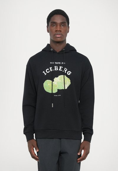 Zwarte hoodie van katoen, met een kleurrijke ijsbergafbeelding en tekst. Lange mouwen, een capuchon met trekkoord en geribde manchetten.