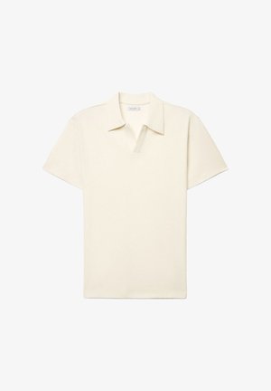 Short-sleeve cream polo shirt with a folded collar and a small V-neck slit on a white background.