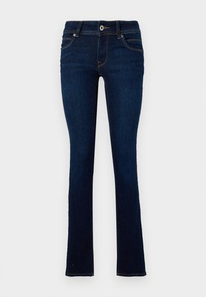 Dark blue jeans made of denim, featuring a slim fit design, five-pocket styling, and light brown stitching along the seams.