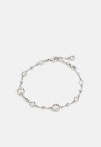 Pulseira de prata com acentos circulares e esféricos, intercalados com pedras transparentes. Fecho ajustável com um pequeno charme anexado.