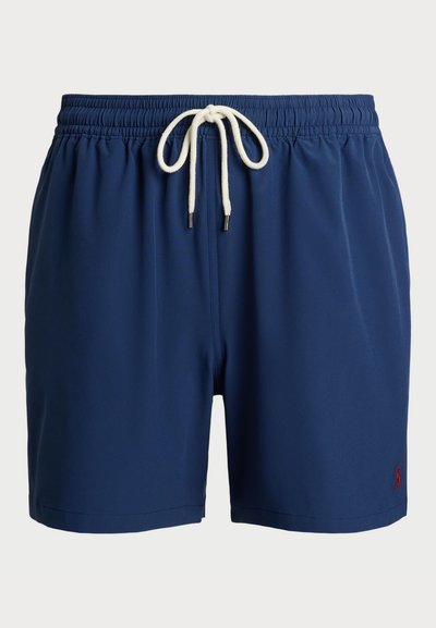 Sötétkék fürdőnadrág könnyű anyagból, rugalmas derékkal, fehér zsinórral és kis piros logóval az oldalon.