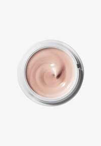 Crema rosa chiaro in un contenitore bianco rotondo, consistenza liscia e lucida con un leggero motivo a vortice sulla superficie.