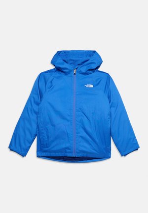 Синьо леко яке с качулка, с цип отпред и лого на The North Face на гърдите, показано на светъл едноцветен фон.