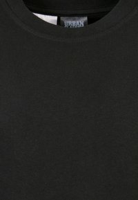 Zwarte T-shirt van katoen met een ronde hals en geribbelde textuur. Etiket zegt "URBAN CLASSICS."