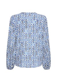 Blouse à manches longues avec un motif floral géométrique bleu et blanc, vue de dos avec des poignets élastiques.