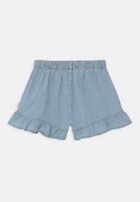 Pantalones cortos rayados en azul y blanco con una cinturilla elástica y un dobladillo con volantes. Fabricados con un tejido ligero, que presenta detalles de costura sutiles.