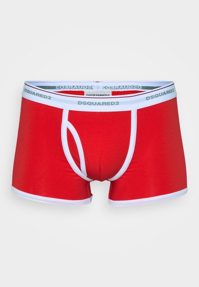 Red men's boxer briefs with a snug fit, white waistband featuring "DSQUARED2" branding, and contrasting white accents along the legs.