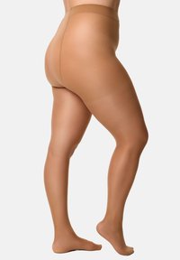 Media de color beige con una cintura alta y textura transparente, que presenta un acabado suave y un diseño sin costuras, cubriendo la pierna hasta la mitad del muslo.
