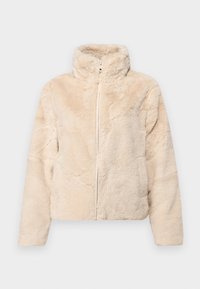 Beige faux fur jacket with a high collar, full front zipper, and textured surface. The design features a relaxed fit and cropped length.
