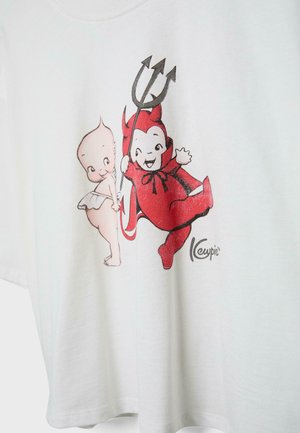 Dvě kreslené miminka na bílém oděvu, jedno oblečené jako červený ďábel s trojzubcem, druhé s andělskými křídly a bílou plenou.