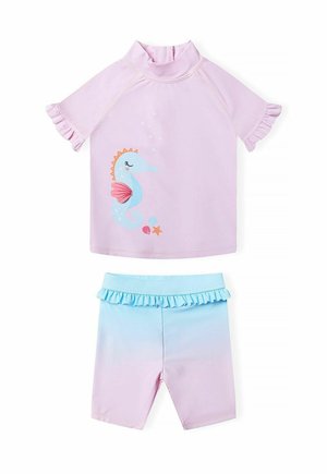 Short-sleeve pink top with ruffle accents featuring a seahorse design. Matching blue gradient shorts with a ruffled waistband.