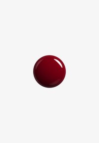 Sphère brillante, ronde et rouge profond, centrée sur un fond uni gris clair avec un reflet blanc sur sa surface.