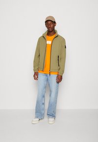 Calvin Klein CRINKLE BLOUSON - Lichte jas - delta green