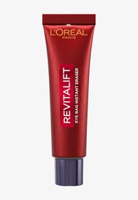 Czerwona tubka z metalicznym wykończeniem, ozdobiona szeroką srebrną nakrętką. Na przedniej etykiecie widnieje napis "REVITALIFT EYE BAG INSTANT ERASER" białym tekstem na czerwonym tle.