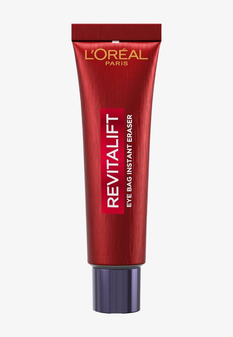 Czerwona tubka z metalicznym wykończeniem, ozdobiona szeroką srebrną nakrętką. Na przedniej etykiecie widnieje napis "REVITALIFT EYE BAG INSTANT ERASER" białym tekstem na czerwonym tle.