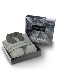 Badeanzug aus Waffelstoff in hellgrauem Material, gefaltet mit einem dunkelgrauen Kragen, präsentiert in einer schwarzen Box mit grauem abstrakten Design.