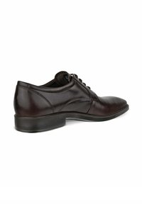 Braune Leder-Dressschuhe mit einer abgerundeten Zehe, glatter Oberfläche, Schnürdesign und einem niedrigen schwarzen Gummihighheel. Detaillierte Nähte entlang des Obermaterials.