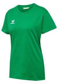 Zielona bawełniana koszulka z okrągłym dekoltem i krótkimi rękawami. Posiada białe logo "hummel" na klatce piersiowej. Gładka tekstura, luźny krój.