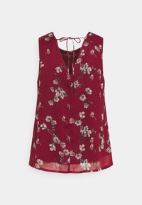 Blusa sin mangas burdeos con escote en V, delicado patrón floral en blanco y naranja, y un detalle de lazo en la parte posterior. Tejido liviano.