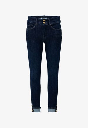 Jean skinny en denim bleu foncé à taille haute, avec deux boutons dorés, poches avant et ourlets retroussés avec des coutures décoratives.