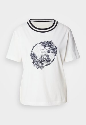 White cotton T-shirt featuring a round floral graphic in navy, with a ribbed neckline in black and white stripes. Short sleeves, relaxed fit.