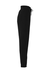 Schwarze Jogginghosen aus weichem Stoff, mit elastischem Bund und Kordelzug, seitlichen Taschen und schmal zulaufenden Beinen.