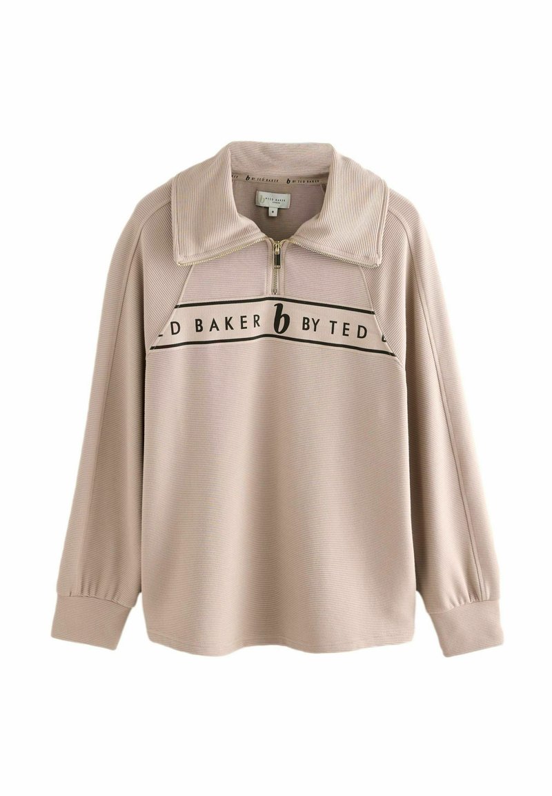 Beige leichter Pullover mit einem Reißverschlusskragen, geripptem Material und schwarzem Branding über der Brust. Mit gefallenen Schultern und langen Ärmeln.