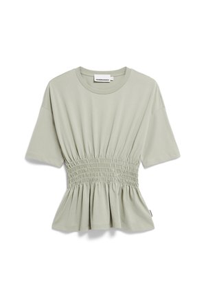 Light green short-sleeve top with a gathered waist, flared bottom, and soft cotton fabric. Features a round neckline and minimal branding label.