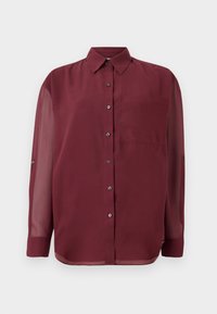 Camicia bordeaux con colletto a punta, maniche lunghe trasparenti, taschino sul petto e bottoni in tonalità argento. Tessuto di trama liscia.