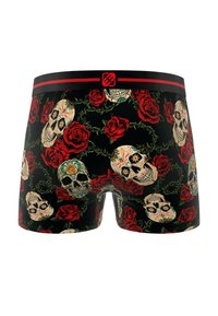 Shorts de boxe noirs avec un motif de crânes crème et de roses rouges, dotés d'une ceinture noire avec des accents rouges et d'un logo au centre.