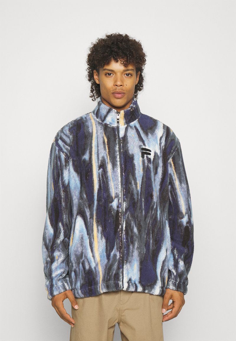 Giacca in pile con zip, design marmorizzato nei colori blu navy, nero, blu e giallo. Caratterizzata da un collare alto e un logo ricamato sul petto.