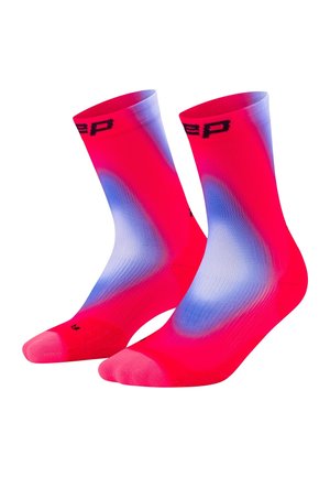 Pair of bright pink crew socks with blue and white gradient patterns and black text near the top cuff.