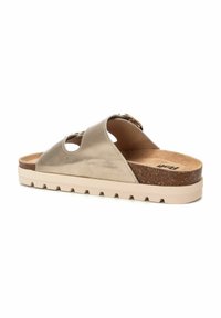 Sandalia deslizante beige con dos cortes en la parte superior, plantilla de corcho y suela de goma texturizada. Material superior suave con un diseño de perfil bajo.